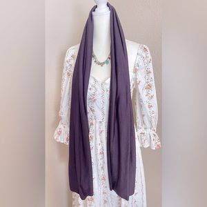 Scarf. New in color purple. smooth. cold.